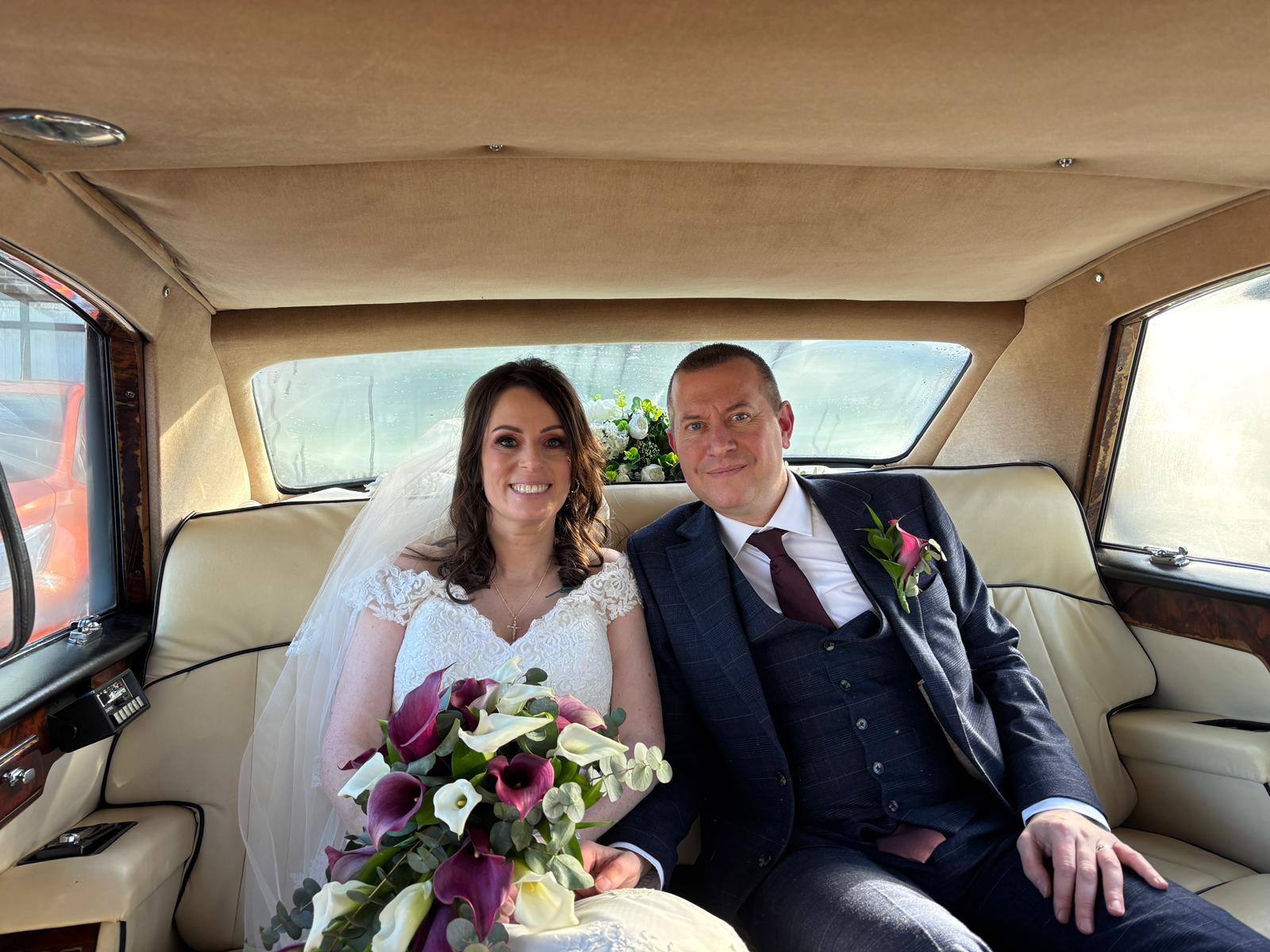 Happy couple with Executive Chariots